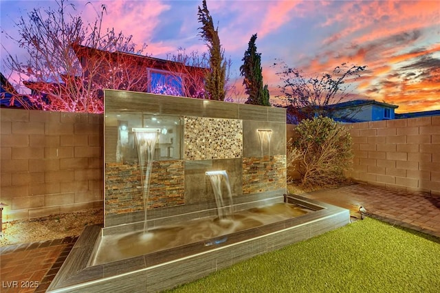 view of outdoor structure with fence