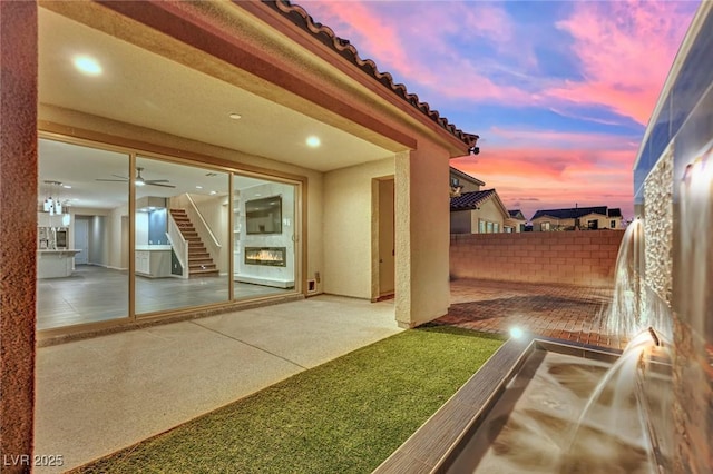 patio terrace at dusk with fence