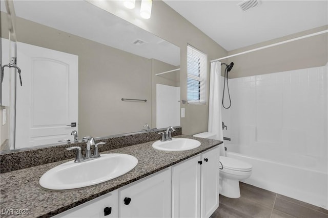 full bathroom featuring double vanity, visible vents, toilet, and a sink