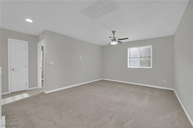 carpeted spare room with visible vents, recessed lighting, a ceiling fan, and baseboards