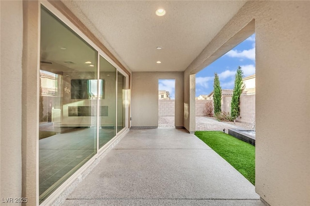 view of patio / terrace featuring fence