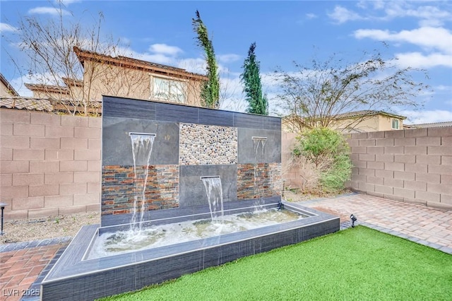exterior details featuring a fenced backyard