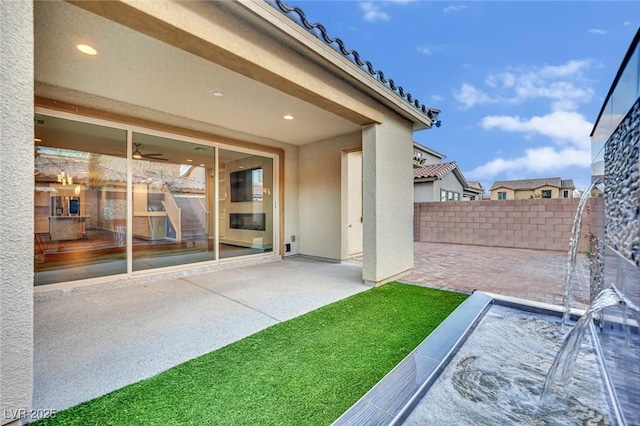 view of patio / terrace featuring fence