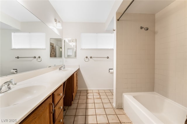 bathroom featuring vanity, tile patterned floors, and tiled shower / bath