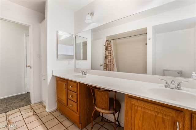 bathroom with a shower with curtain, vanity, toilet, and tile patterned flooring