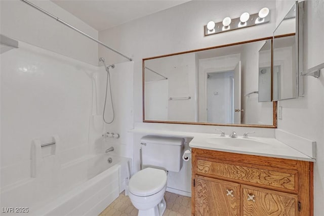 full bathroom featuring washtub / shower combination, vanity, and toilet