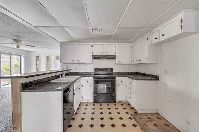 kitchen with white cabinetry, sink, black appliances, and kitchen peninsula