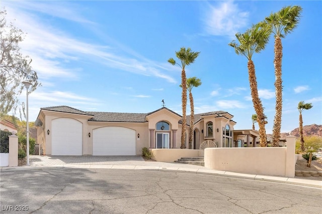 view of front of property featuring a garage