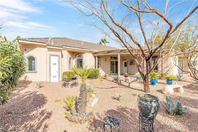 back of property with a patio area