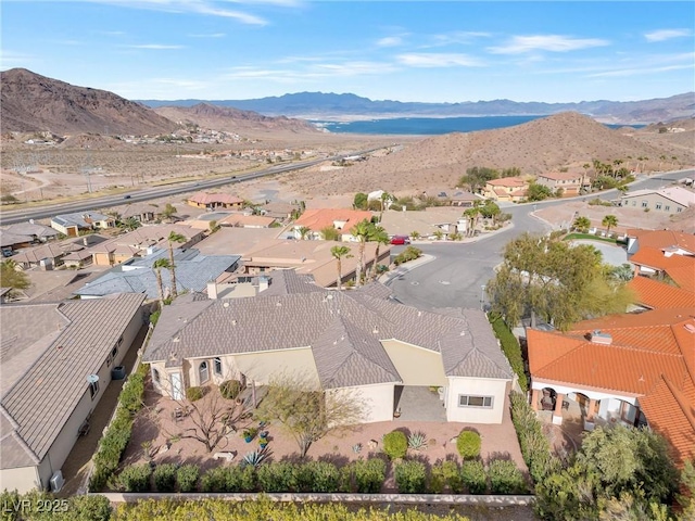 birds eye view of property with a mountain view