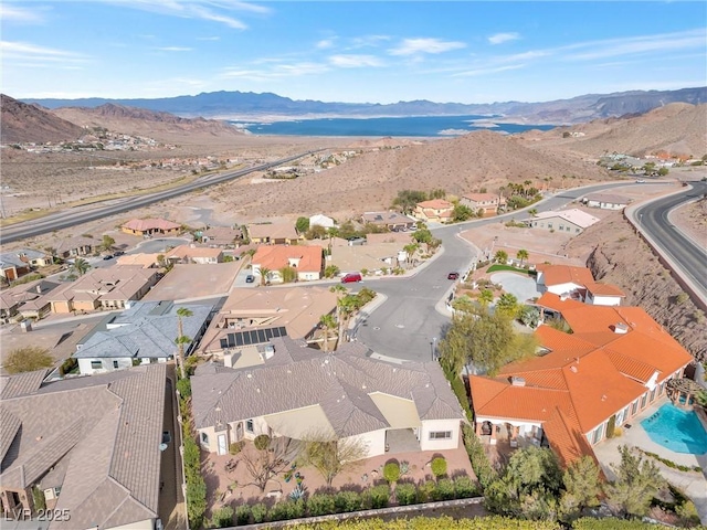 birds eye view of property with a mountain view