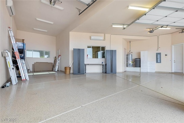 garage featuring strapped water heater, a garage door opener, a wall unit AC, and electric panel