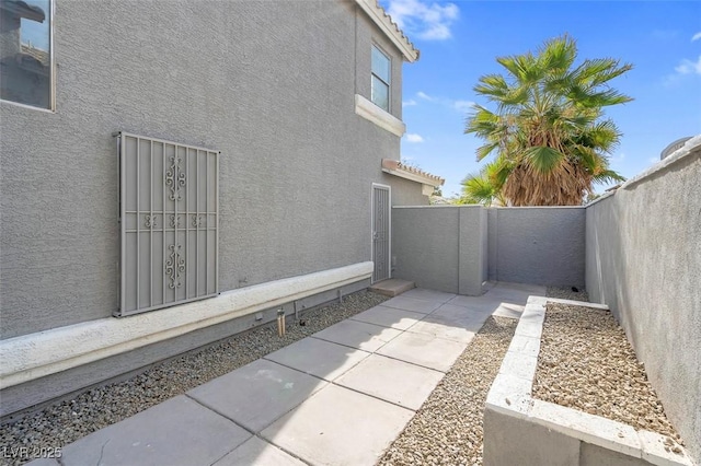 view of property exterior featuring a patio area