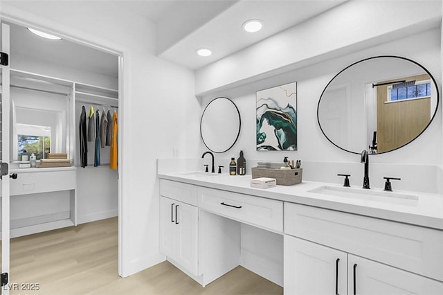 bathroom with vanity and wood-type flooring