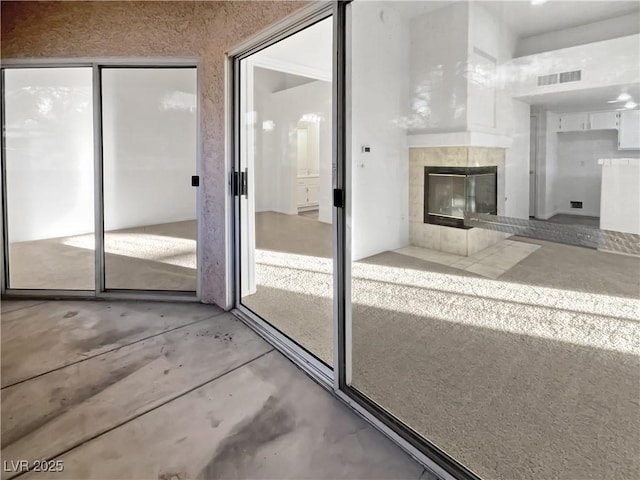 interior space featuring a tile fireplace