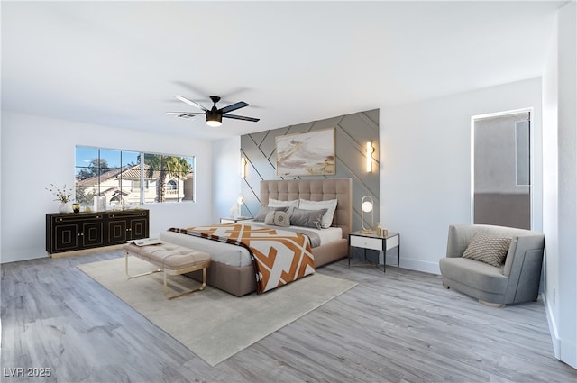 bedroom featuring light hardwood / wood-style floors and ceiling fan