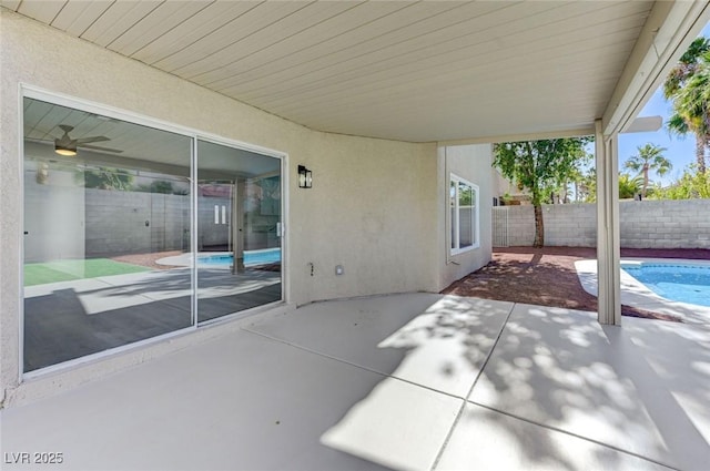 view of patio / terrace with a fenced in pool