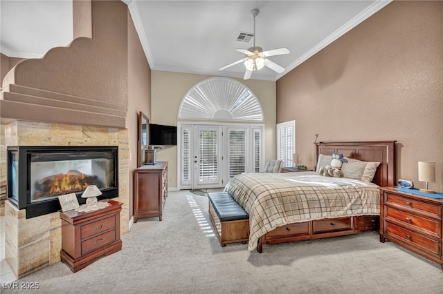 bedroom with a multi sided fireplace, access to exterior, crown molding, and light colored carpet