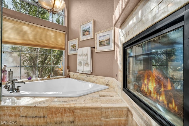 bathroom with tiled bath