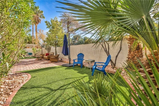 view of yard with outdoor lounge area and a patio area