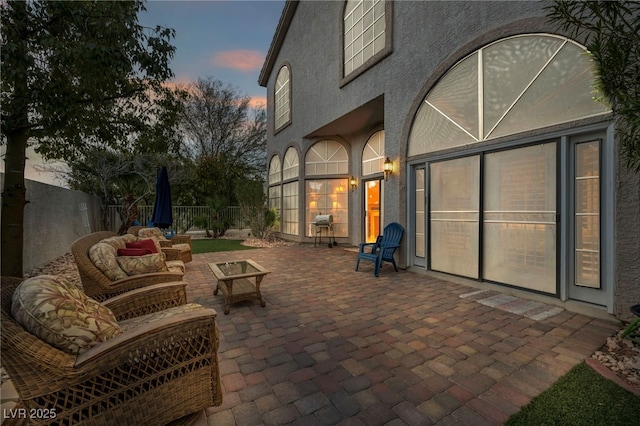 patio terrace at dusk with an outdoor living space