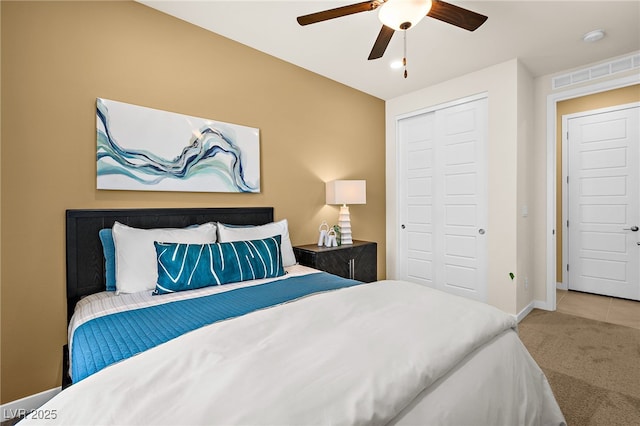 bedroom featuring ceiling fan, carpet flooring, and a closet