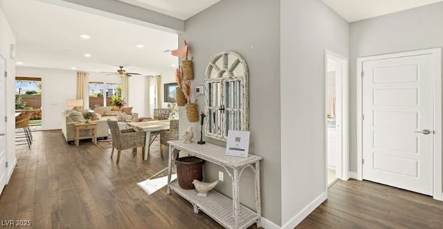 hallway with dark hardwood / wood-style flooring