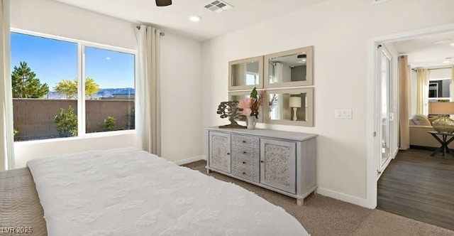 bedroom with ceiling fan and carpet