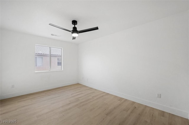 unfurnished room with ceiling fan and light wood-type flooring