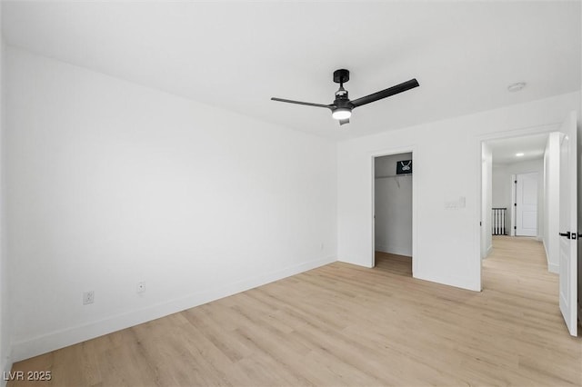 unfurnished bedroom with ceiling fan, light hardwood / wood-style floors, and a closet