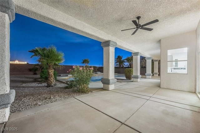 patio terrace at dusk with ceiling fan