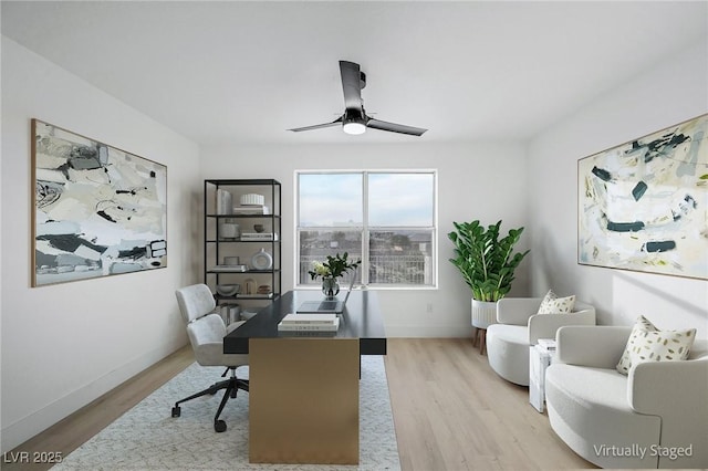 office space with light hardwood / wood-style flooring and ceiling fan