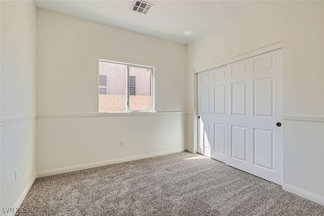 unfurnished bedroom featuring a closet and carpet