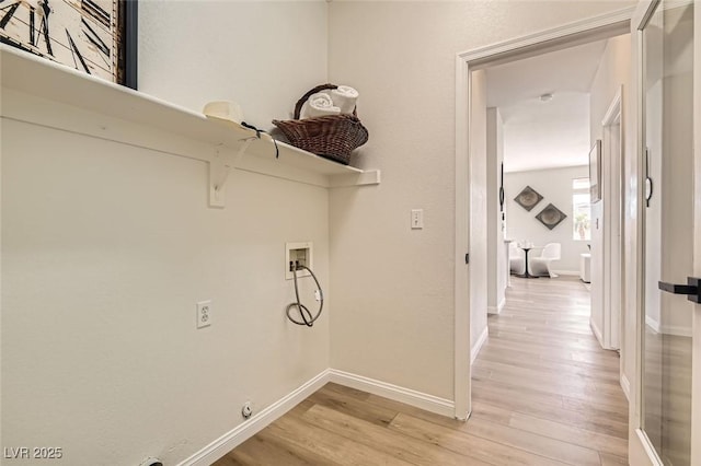 washroom featuring washer hookup and light hardwood / wood-style floors