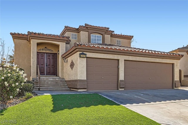 mediterranean / spanish-style house with driveway, an attached garage, a tile roof, and stucco siding