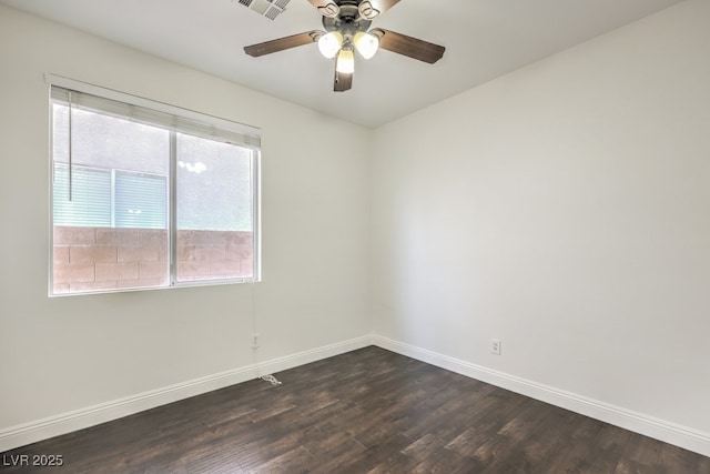 empty room featuring ceiling fan and dark hardwood / wood-style floors