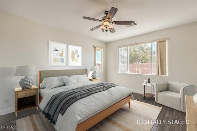 bedroom with dark wood-type flooring and ceiling fan