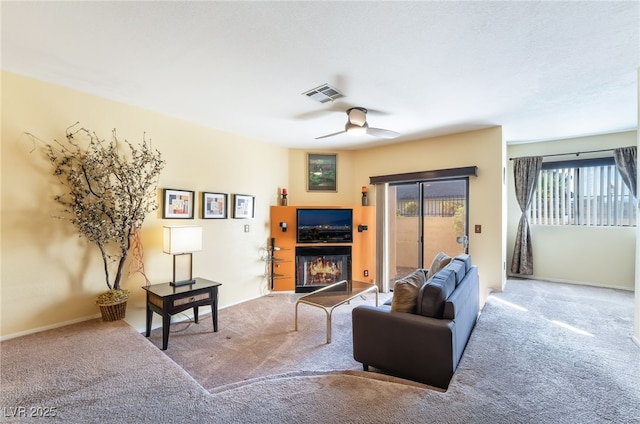 living room with carpet and ceiling fan