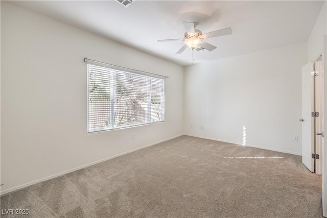 carpeted empty room with ceiling fan