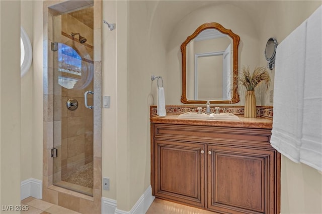 bathroom featuring walk in shower and vanity