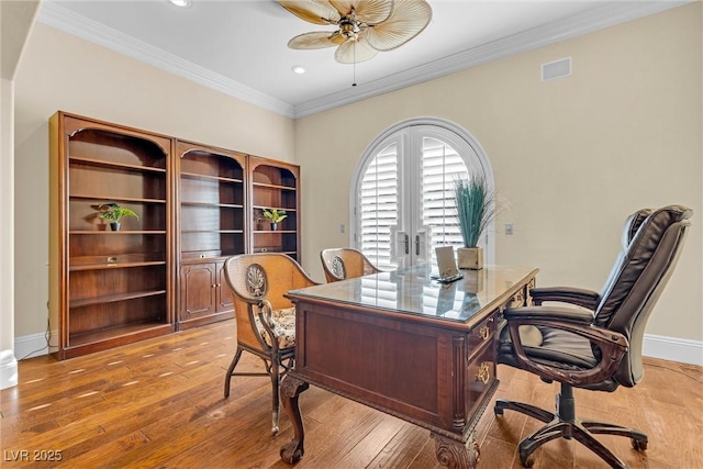 office area featuring french doors, ceiling fan, ornamental molding, and light wood-type flooring