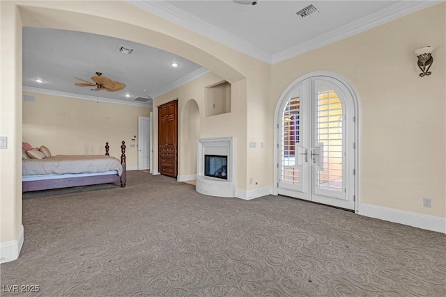 unfurnished bedroom with ornamental molding, light carpet, access to outside, and french doors