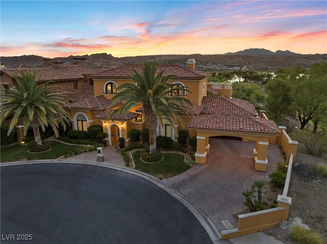 mediterranean / spanish-style home with a mountain view