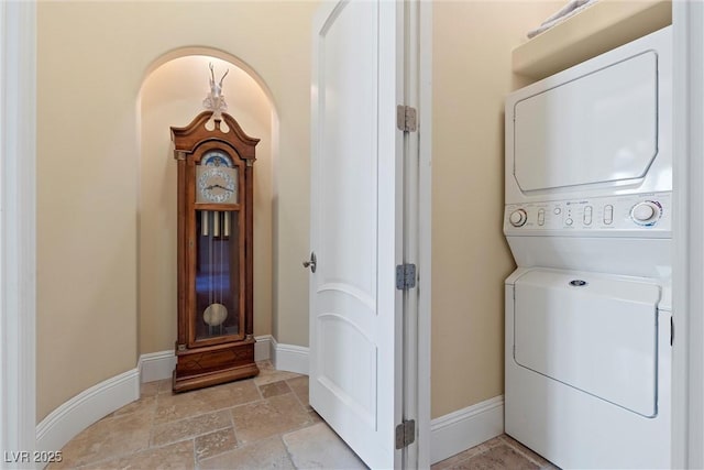 laundry area with stacked washer and clothes dryer