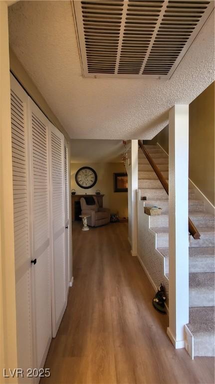 corridor featuring hardwood / wood-style floors