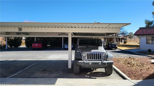 view of vehicle parking featuring a carport