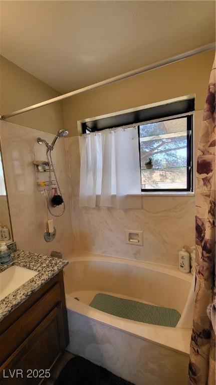 bathroom with shower / bath combo and vanity