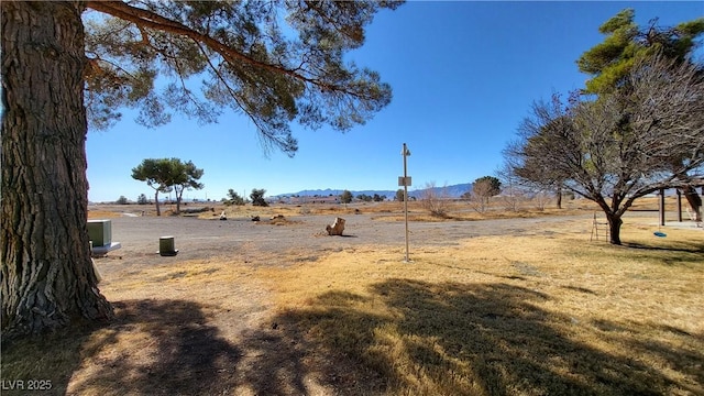 view of yard featuring a rural view and cooling unit