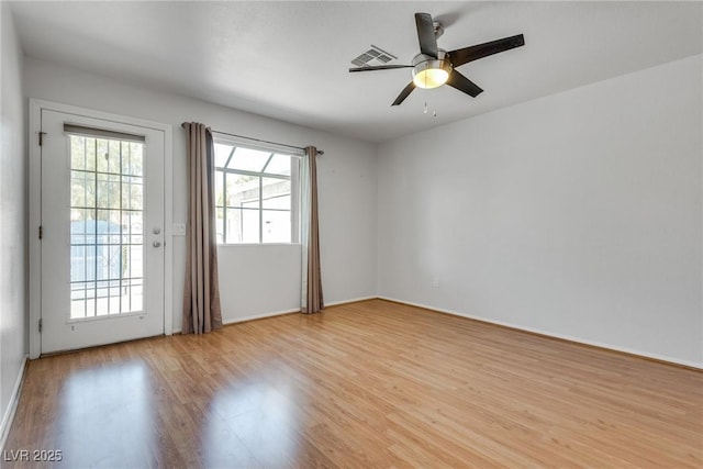 spare room featuring light hardwood / wood-style flooring and ceiling fan