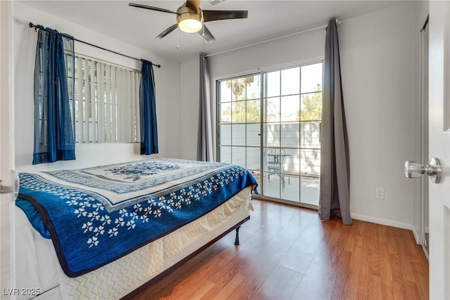 bedroom featuring hardwood / wood-style flooring and ceiling fan